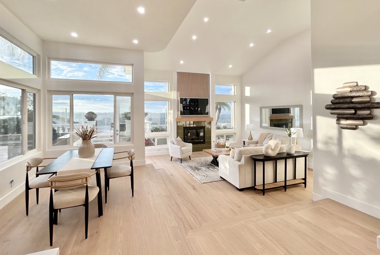 Spacious furnished living room with fireplace and natural light