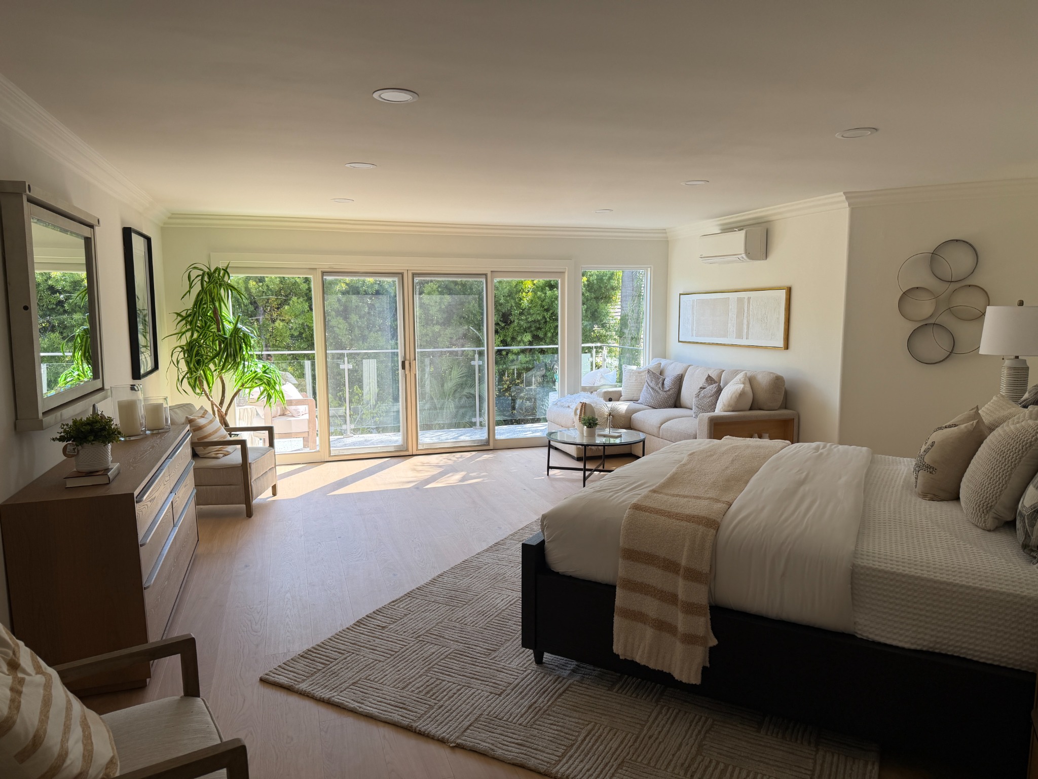 Bright renovated living and sleeping suite with expansive windows